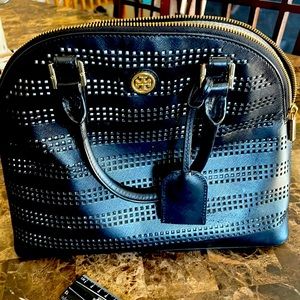 Tory Burch handbag 10x14 size black. Has minor stains on the inside.